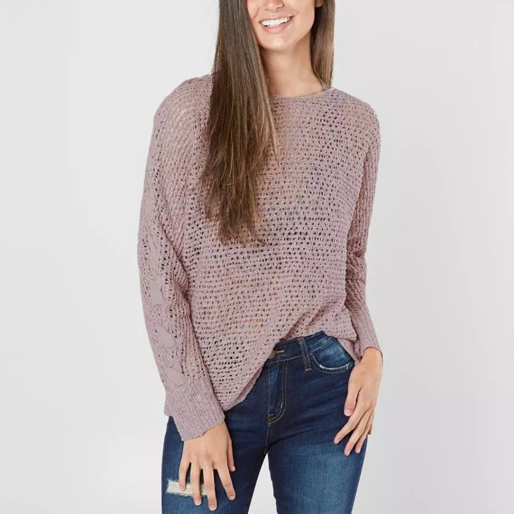 Daytrip open stitch knit light purple long sleeve top. Braid detail on the slee